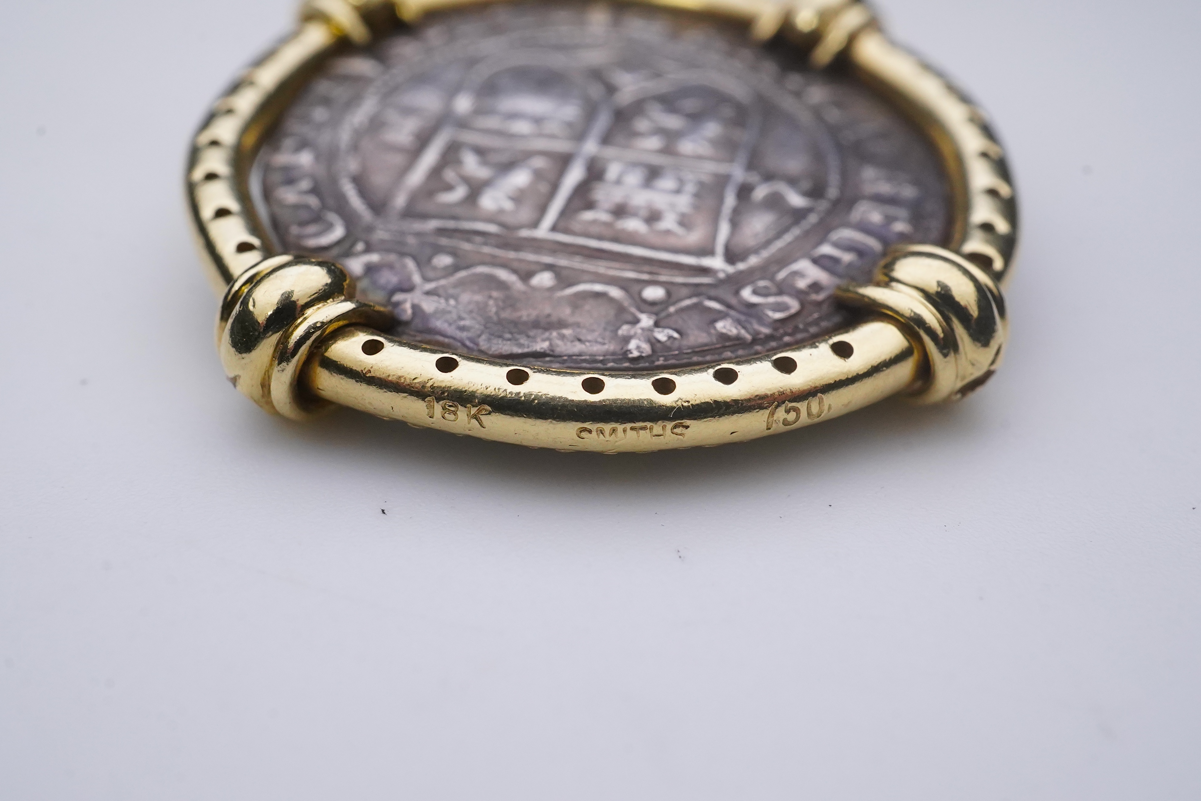 An unusual diamond and 16th century Mexican coin pendant